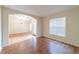 Bright living room with wood floors and a large window with natural light at 1530 Monica St, Deltona, FL 32725