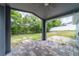 View of the outdoor patio with patterned brick flooring and an open view of the backyard at 1530 Monica St, Deltona, FL 32725