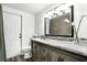 Bathroom with updated vanity with marble countertops, modern lighting, and wood-look flooring at 161 Peacock, Altamonte Springs, FL 32701