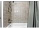 Bathroom featuring a shower with a gray tiled wall and an adjustable shower head at 161 Peacock, Altamonte Springs, FL 32701