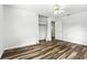 Simple bedroom design features an open closet concept, fan, and wood-look flooring at 161 Peacock, Altamonte Springs, FL 32701