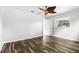 This is a spacious bedroom featuring wood-look floors and a ceiling fan at 161 Peacock, Altamonte Springs, FL 32701