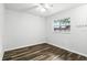 Bright bedroom features hardwood floors and a large window with outdoor views at 161 Peacock, Altamonte Springs, FL 32701