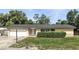 Charming one-story home with a well-manicured front yard and attached garage at 161 Peacock, Altamonte Springs, FL 32701