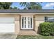 Inviting front entrance featuring a white door with glass panels and brick landing at 161 Peacock, Altamonte Springs, FL 32701