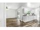Bright and open kitchen-living area with modern white cabinets and sleek countertops at 161 Peacock, Altamonte Springs, FL 32701
