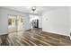 Spacious living room features wood-look flooring and sliding glass doors leading to patio at 161 Peacock, Altamonte Springs, FL 32701