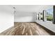 Open living room featuring wood-look floors and natural light from the many windows at 161 Peacock, Altamonte Springs, FL 32701