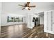 Bright and open living room featuring wood-look floors and easy kitchen access at 161 Peacock, Altamonte Springs, FL 32701