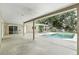 Covered patio area adjacent to the sparkling blue swimming pool at 161 Peacock, Altamonte Springs, FL 32701