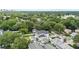 Gorgeous aerial view of a pristine home featuring a luxurious pool, backyard, and lush surroundings at 1620 S Eola Dr, Orlando, FL 32806