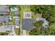 Birds eye shot of a house featuring a private pool, lush landscaping, and neighboring properties at 1620 S Eola Dr, Orlando, FL 32806