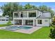 Beautiful backyard with pool, jacuzzi, covered patio, and well-maintained green lawn at 1620 S Eola Dr, Orlando, FL 32806
