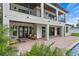 Multi-level deck and backyard featuring a covered patio area with outside seating and access to a pool at 1620 S Eola Dr, Orlando, FL 32806