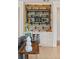 Contemporary dry bar with wine fridge, custom shelving, and stylish lighting at 1620 S Eola Dr, Orlando, FL 32806