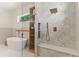 Bright bathroom with glass shower, soaking tub, window, and hardwood accent shelves at 1620 S Eola Dr, Orlando, FL 32806