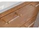 Close up on wooden bathroom cabinet with clear hardware and luxurious wooden finish at 1620 S Eola Dr, Orlando, FL 32806