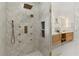 Elegant primary bathroom boasts a gorgeous glass shower, double vanity, and stylish tile at 1620 S Eola Dr, Orlando, FL 32806