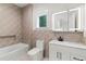 Modern bathroom featuring geometric tile surround, and a square LED mirror at 1620 S Eola Dr, Orlando, FL 32806