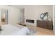 Well-lit bedroom with modern fireplace, stylish furniture, and ensuite bathroom access at 1620 S Eola Dr, Orlando, FL 32806