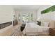Bright primary bedroom with a modern fireplace, doors to the patio, and stylish rug at 1620 S Eola Dr, Orlando, FL 32806
