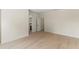 Bright, airy bedroom with light wood floors and an ensuite bathroom at 1620 S Eola Dr, Orlando, FL 32806