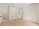 Bright, empty bedroom featuring light wood floors and white trim at 1620 S Eola Dr, Orlando, FL 32806