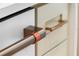Close up detail of cabinet hardware with bronze pulls; featuring the Cafe brand logo at 1620 S Eola Dr, Orlando, FL 32806