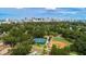 Aerial view of a well-maintained community featuring sports facilities and a beautiful city skyline at 1620 S Eola Dr, Orlando, FL 32806