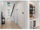 Bright entryway with hardwood floors, a staircase, and a stylish dry bar at 1620 S Eola Dr, Orlando, FL 32806