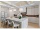 Open kitchen with a large island, pendant lights, and stainless steel appliances at 1620 S Eola Dr, Orlando, FL 32806