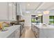 Bright kitchen features a large island, modern cabinets, stainless appliances, and access to outdoor living space at 1620 S Eola Dr, Orlando, FL 32806