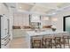 Bright kitchen with an island, wood floors, designer fixtures, and stainless steel appliances at 1620 S Eola Dr, Orlando, FL 32806