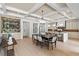 Spacious living area with coffered ceilings, a dining table, and a bar area at 1620 S Eola Dr, Orlando, FL 32806