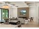 Open concept living area with a modern fireplace, TV, and seamless indoor-outdoor flow at 1620 S Eola Dr, Orlando, FL 32806
