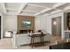Bright living room with modern fireplace, open to dining area, and coffered ceilings at 1620 S Eola Dr, Orlando, FL 32806