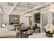 Open concept living and dining areas with coffered ceilings and a modern fireplace at 1620 S Eola Dr, Orlando, FL 32806