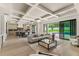 Open living room featuring a modern sofa, coffee table, and access to the outdoor pool area at 1620 S Eola Dr, Orlando, FL 32806