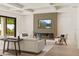 Living room featuring a modern fireplace, wood accent wall and neutral décor at 1620 S Eola Dr, Orlando, FL 32806