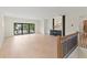 Upstairs living area with light wood floors, a wet bar and access to a balcony at 1620 S Eola Dr, Orlando, FL 32806