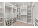 A well-lit walk-in closet featuring custom shelves, drawers, and hanging racks at 1620 S Eola Dr, Orlando, FL 32806