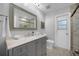 Bright bathroom with tiled floor, large vanity, oversized mirror, and enclosed tiled shower at 223 Royal Oaks Cir, Longwood, FL 32779