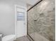 Renovated bathroom features glass shower, tile floor, and sleek vanity at 223 Royal Oaks Cir, Longwood, FL 32779