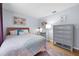 Cozy bedroom with stylish decor, featuring a comfortable bed, desk area, and a gray dresser at 223 Royal Oaks Cir, Longwood, FL 32779