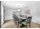 Formal dining room with modern chandelier, stylish chairs, and decorative accents at 223 Royal Oaks Cir, Longwood, FL 32779