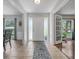 Bright entryway with tile floors, a decorative rug, and a view into adjacent rooms at 223 Royal Oaks Cir, Longwood, FL 32779