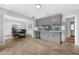 Open concept kitchen and dining room offer tile floors, granite counters, and ample storage at 223 Royal Oaks Cir, Longwood, FL 32779