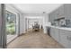 Open concept kitchen features grey cabinets, stainless appliances, and tile flooring at 223 Royal Oaks Cir, Longwood, FL 32779
