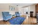 Comfortable living room with hardwood floors, blue furniture, and natural light at 223 Royal Oaks Cir, Longwood, FL 32779