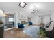 Bright living room with painted brick fireplace and skylight at 223 Royal Oaks Cir, Longwood, FL 32779